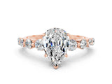 Rose gold Pear Cut Solitaire Moissanite Ring with Pave Band and Four-Prong Setting