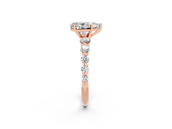 Rose gold Pear Cut Solitaire Moissanite Ring with Pave Band and Four-Prong Setting