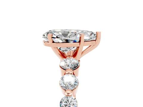 Rose gold Pear Cut Solitaire Moissanite Ring with Pave Band and Four-Prong Setting_5