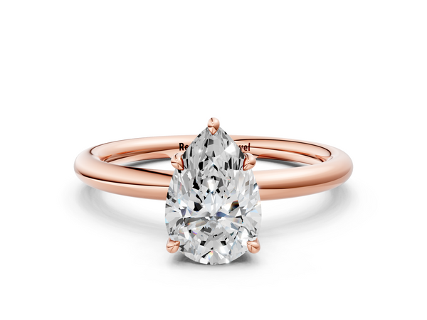 Rose gold Pear Cut Diamond Solitaire Ring with Thin Band and Four-Prong Setting
