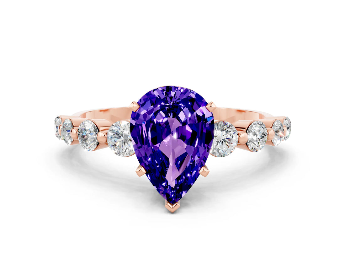 Rose gold Pear Cut Solitaire Tanzanite Ring with Pave Band and Four-Prong Setting