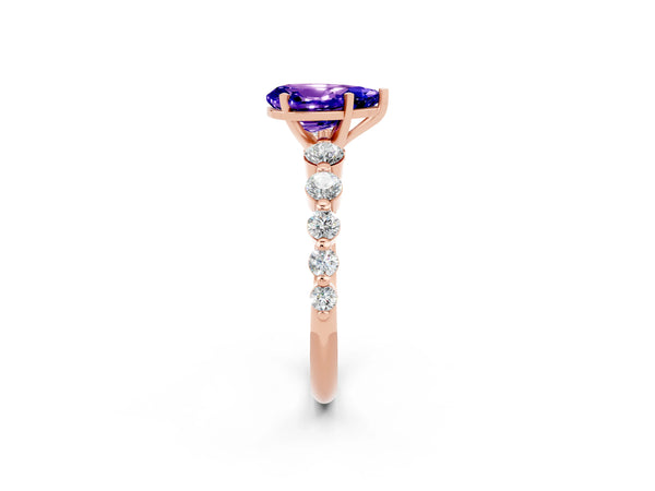 Rose gold Pear Cut Solitaire Tanzanite Ring with Pave Band and Four-Prong Setting