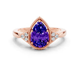 Rose gold Pear Cut Tanzanite Halo Ring with Tapered Band and Four-Prong Setting