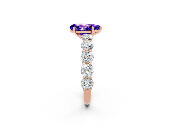 Rose gold Pear Cut Tanzanite Prong Setting with Side Stones on a Pave Band