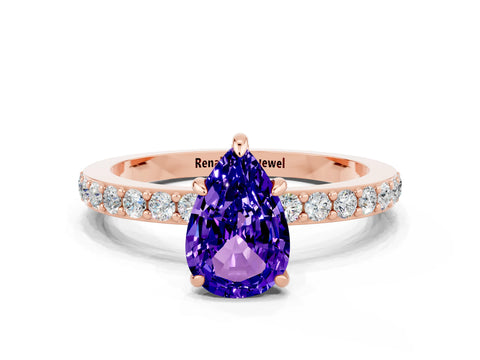 Rose gold Pear Cut Tanzanite Ring with Pavé Band and Four-Prong Setting