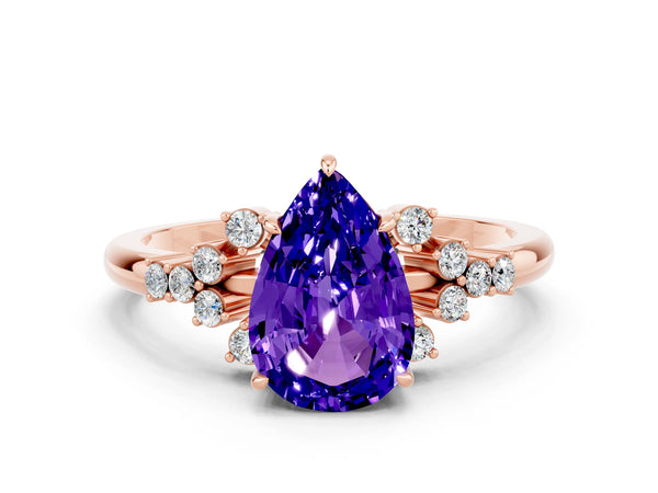 Rose gold Pear Cut Tanzanite Ring with Side Stones and Four-Prong Setting
