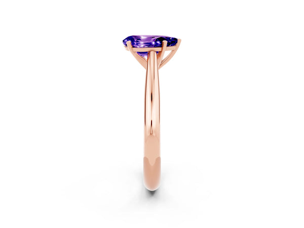 Rose gold Pear Cut Tanzanite Solitaire Engagement Ring with Cathedral Setting and Four-Prong Mount