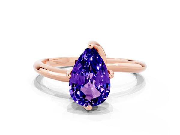Rose gold Pear Cut Tanzanite Solitaire Engagement Ring with Four-Prong Setting and Classic Band