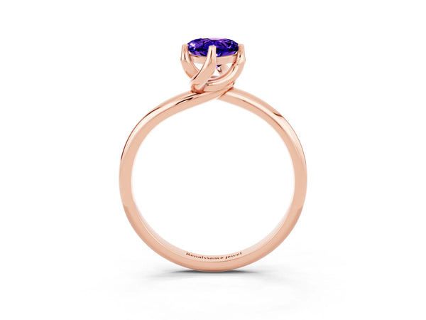 Rose gold Pear Cut Tanzanite Solitaire Engagement Ring with Four-Prong Setting and Classic Band