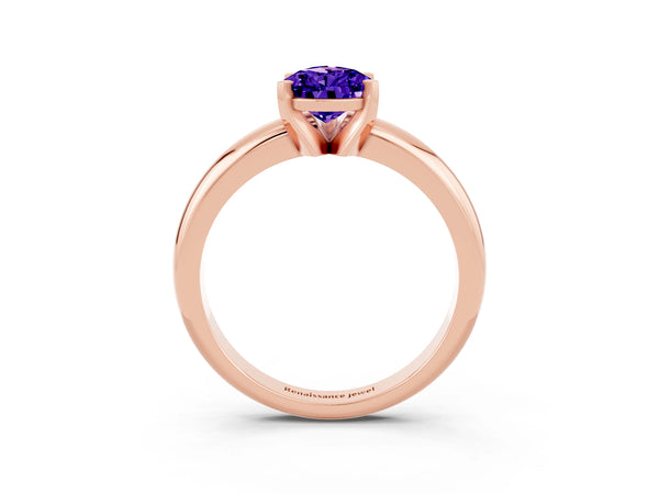 Rose gold Pear Cut Tanzanite Solitaire Engagement Ring with Round Band and Four-Prong Setting