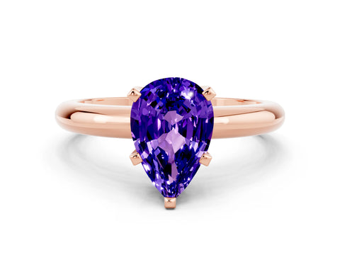 Rose gold Pear Cut Tanzanite Solitaire Engagement Ring with Round Band and Four-Prong Setting