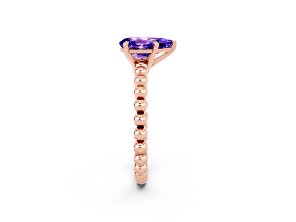 Rose gold Pear Cut Tanzanite Solitaire Ring with Beaded Band and Prong Setting