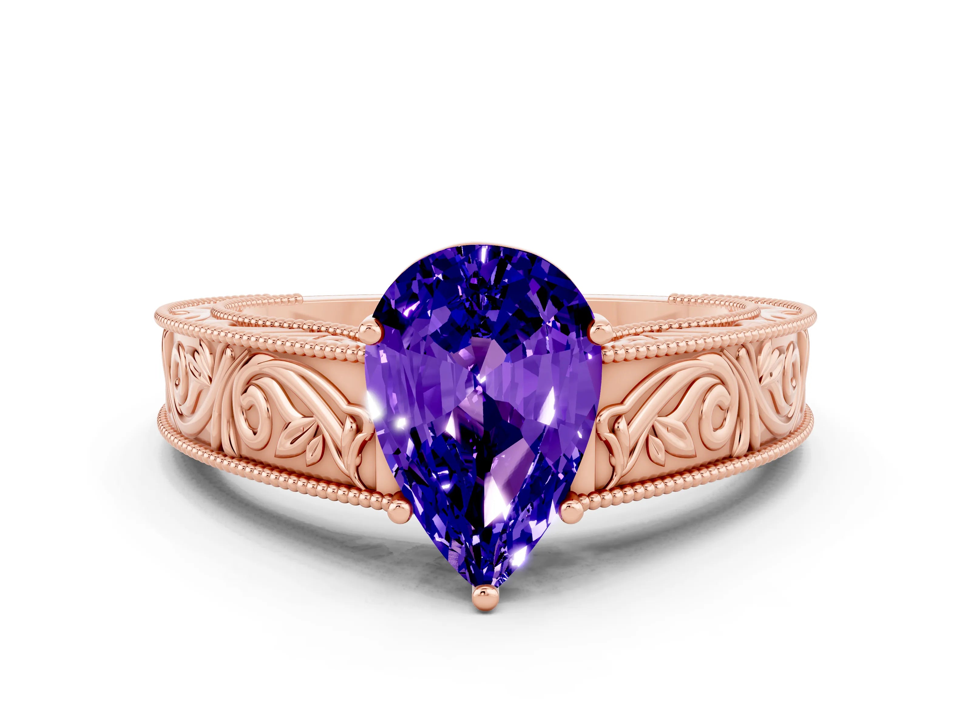 Rose gold Pear Cut Tanzanite Solitaire Ring with Engraved Band and Four-Prong Setting