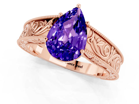 Rose gold Pear Cut Tanzanite Solitaire Ring with Engraved Band and Four-Prong Setting_1