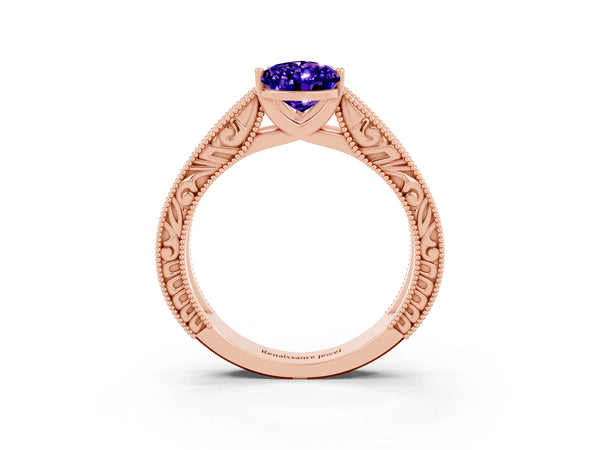 Rose gold Pear Cut Tanzanite Solitaire Ring with Engraved Band and Four-Prong Setting