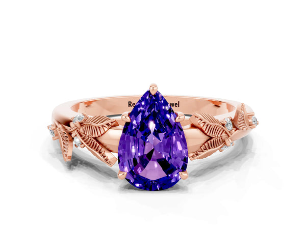 Rose gold Pear Cut Tanzanite Solitaire Ring with Leaf Motif Band and Four-Prong Setting