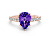 Rose gold Pear Cut Tanzanite Solitaire Ring with Pavé Accents and Four-Prong Setting