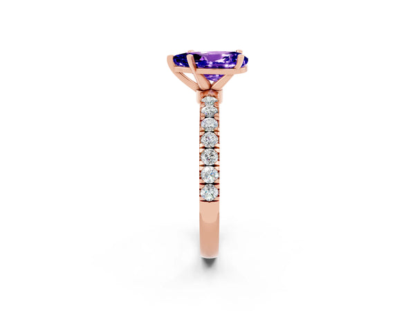 Rose gold Pear Cut Tanzanite Solitaire Ring with Pavé Accents and Four-Prong Setting