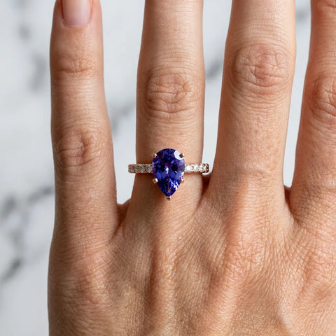Rose gold Pear Cut Tanzanite Solitaire Ring with Round  Pavé Band and Four-Prong Setting_30