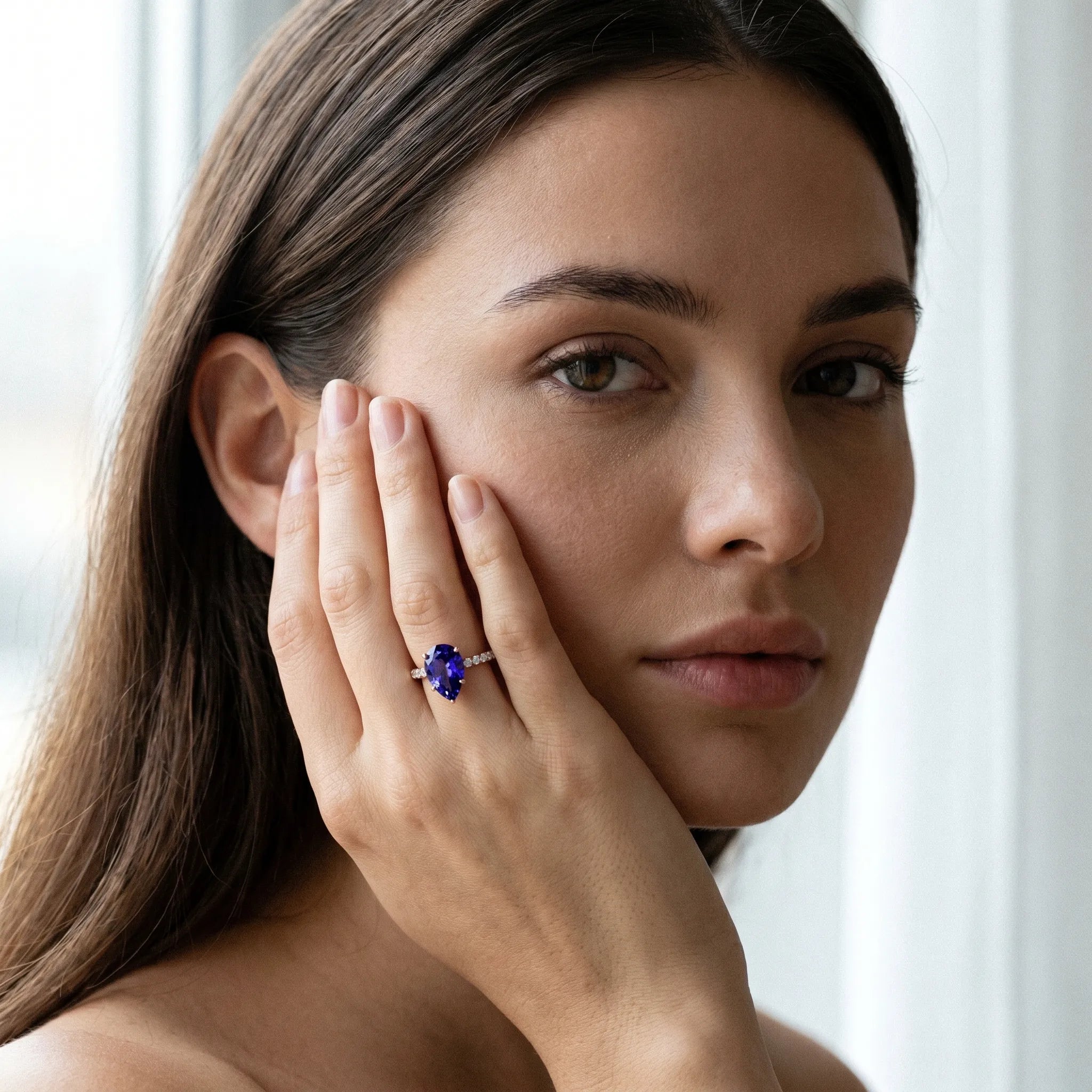 Rose gold Pear Cut Tanzanite Solitaire Ring with Round  Pavé Band and Four-Prong Setting_31