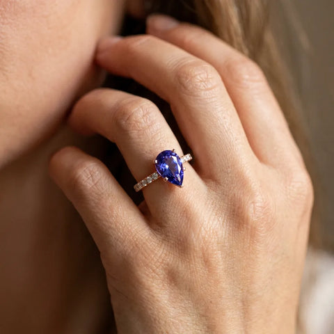 Rose gold Pear Cut Tanzanite Solitaire Ring with Round  Pavé Band and Four-Prong Setting_32