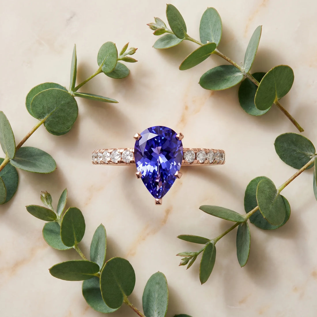 Rose gold Pear Cut Tanzanite Solitaire Ring with Round  Pavé Band and Four-Prong Setting_33