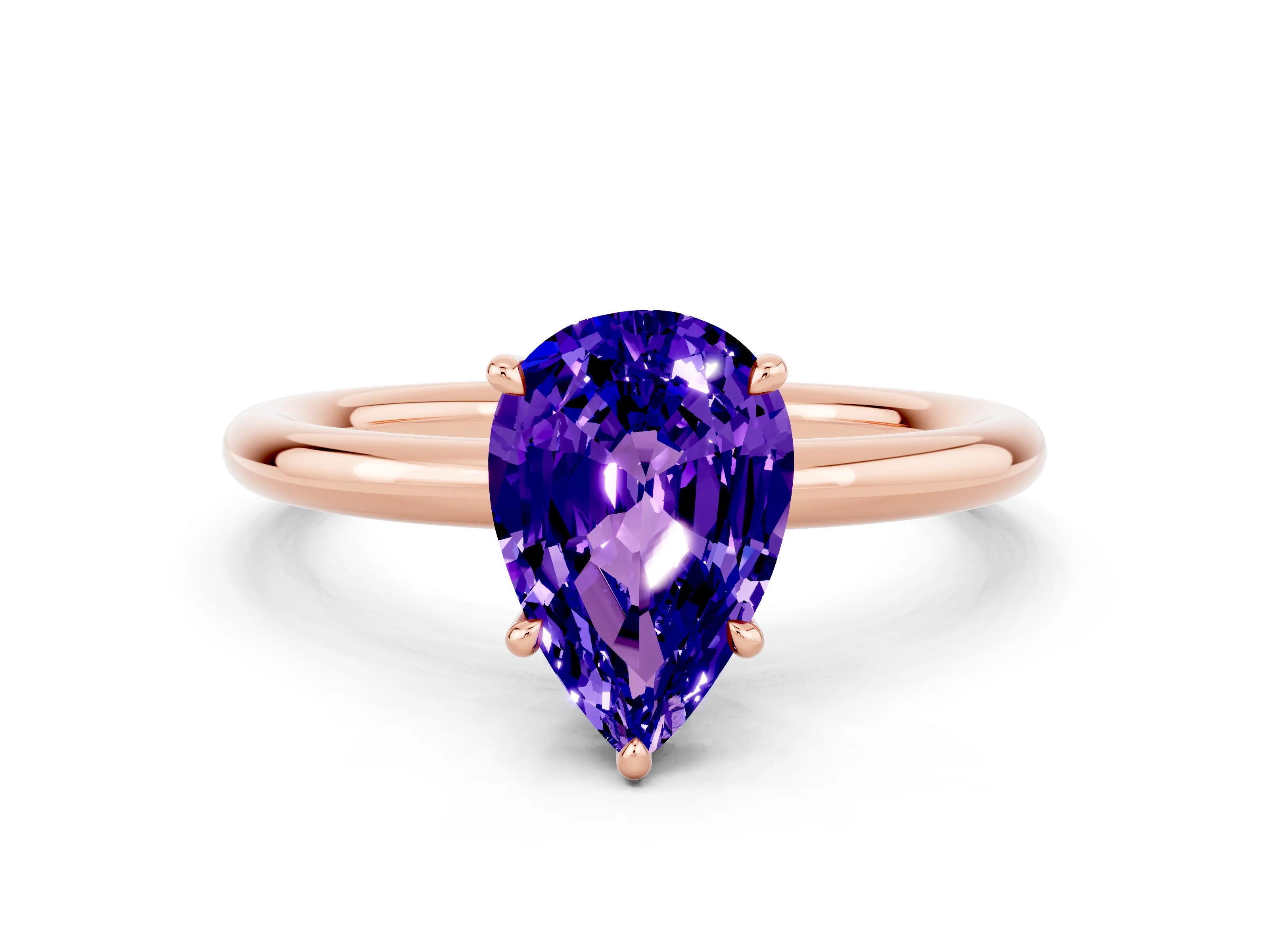 Rose gold Pear Cut Tanzanite Solitaire Ring with Thin Band and Four-Prong Setting