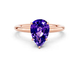 Rose gold Pear Cut Tanzanite Solitaire Ring with Thin Band and Four-Prong Setting
