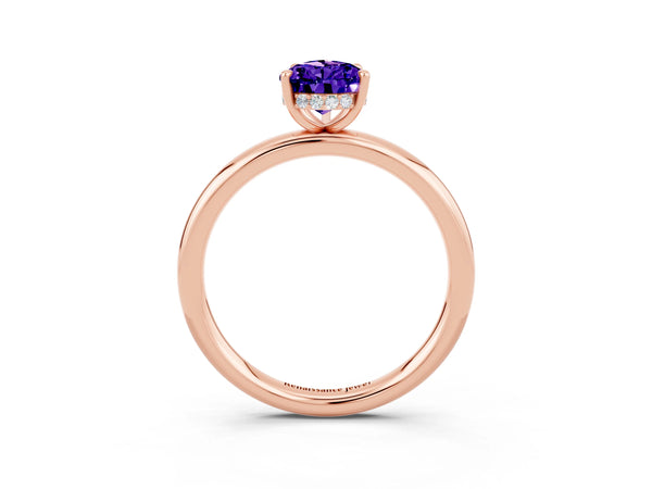 Rose gold Pear Cut Tanzanite Solitaire Ring with Thin Band and Four-Prong Setting