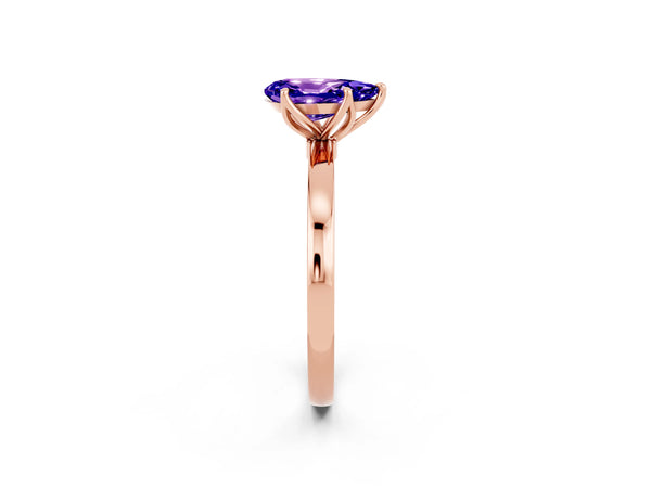 Rose gold Pear Cut Tanzanite Solitaire Ring with Thin Band and Prong Setting