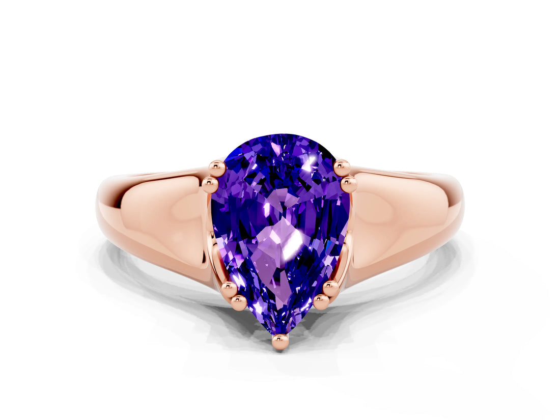 Rose gold Pear Cut Tanzanite Solitaire Ring with Wide Band and Prong Setting