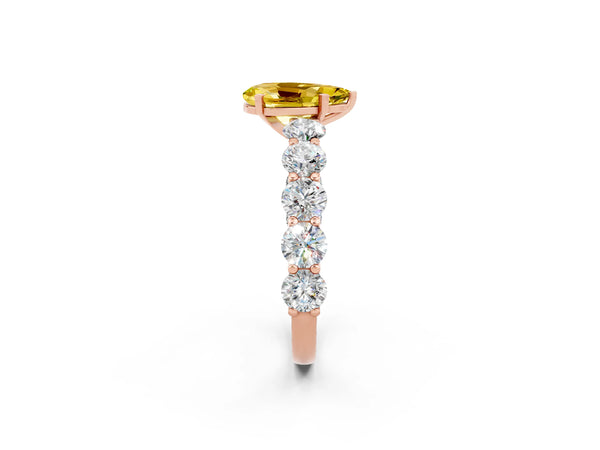 Rose gold Pear Cut Yellow Sapphire Prong Setting with Side Stones on a Pave Band