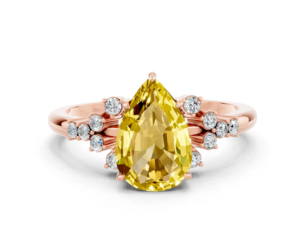 Rose gold Pear Cut Yellow Sapphire Ring with Side Stones and Four-Prong Setting