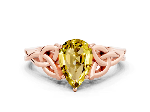 Rose gold Pear Cut Yellow Sapphire Solitaire Engagement Ring with Celtic Knot Band and Four-Prong Setting