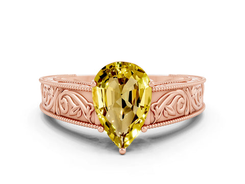 Rose gold Pear Cut Yellow Sapphire Solitaire Ring with Engraved Band and Four-Prong Setting