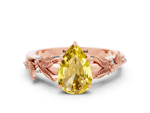 Rose gold Pear Cut Yellow Sapphire Solitaire Ring with Leaf Motif Band and Four-Prong Setting
