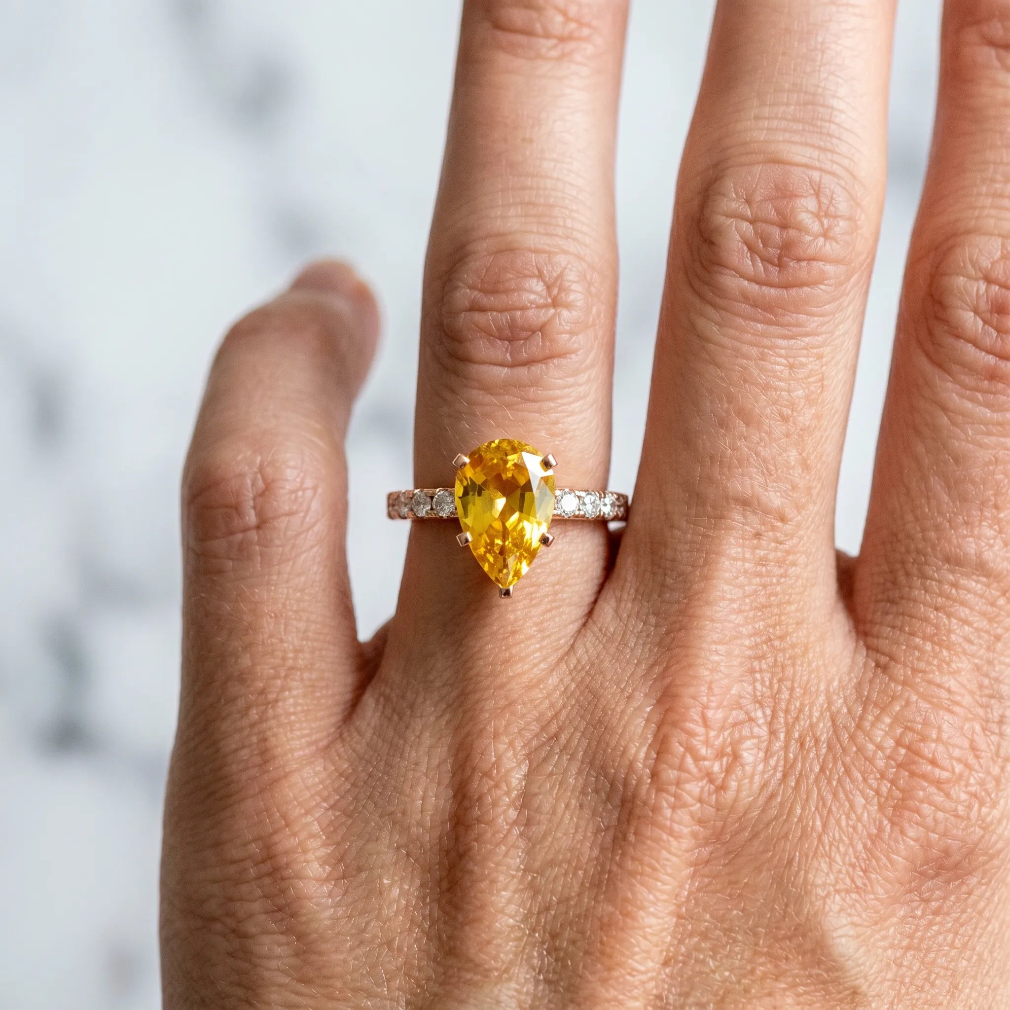 Rose gold Pear Cut Yellow Sapphire Solitaire Ring with Round  Pavé Band and Four-Prong Setting_78