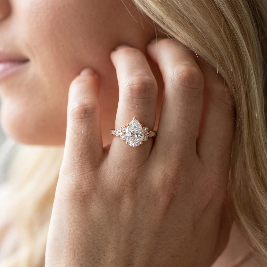 Rose gold Pear Diamond Bezel and Prong Setting with Pave Band