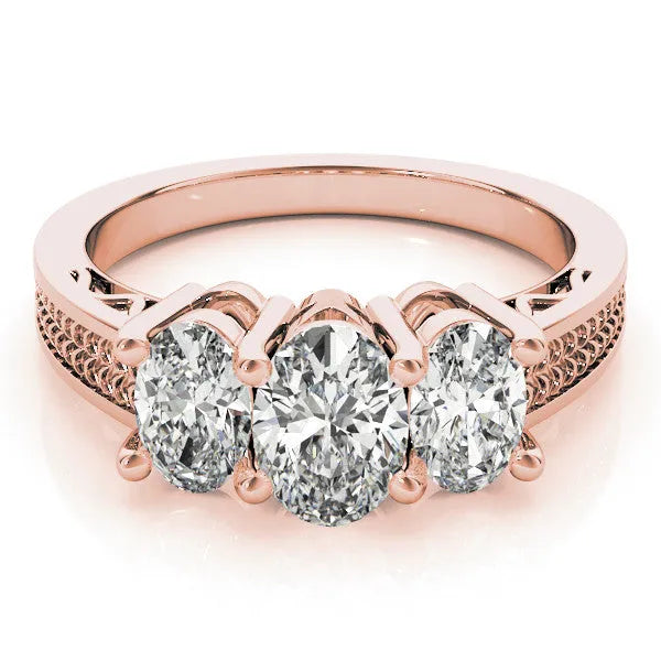 Rose gold Pear Diamond Three-Stone Ring with Prong Setting and Textured Band