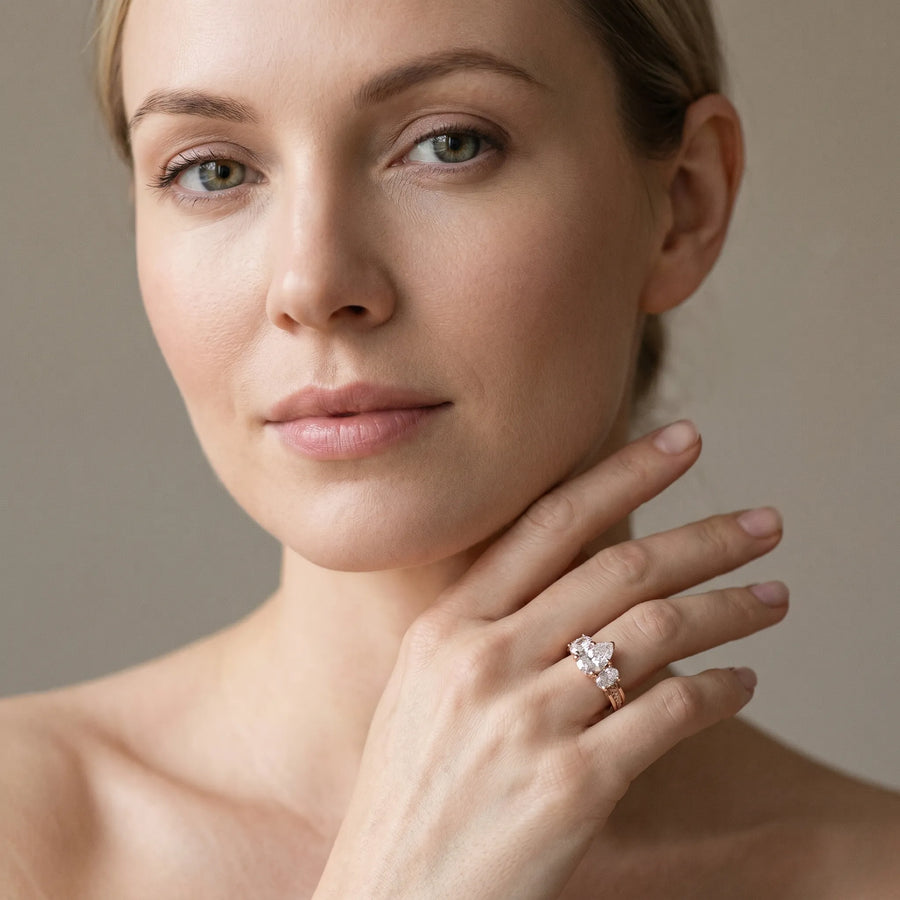 Rose gold Pear Diamond Three-Stone Ring with Prong Setting and Textured Band