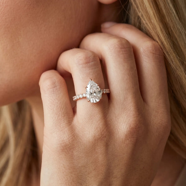 Rose gold Pear Solitaire Diamond Engagement Ring with Pavé Band and Six-Prong Setting