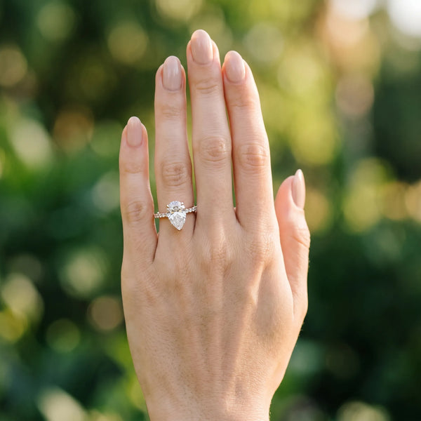 Rose gold Pear Solitaire Diamond Engagement Ring with Pave Band and Six-Prong Setting