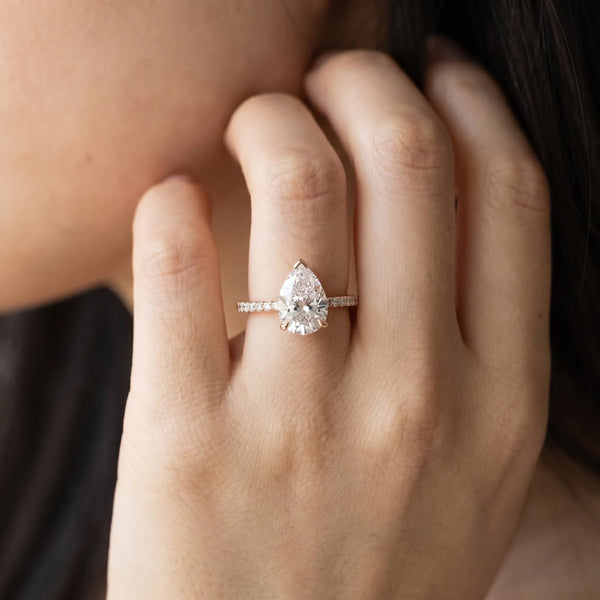 Rose gold Pear Solitaire Diamond Engagement Ring with Pave Band and Six-Prong Setting