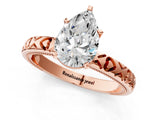Rose gold Pear Solitaire Diamond Engagement Ring with XO Engraved Band and Four-Prong Setting 1