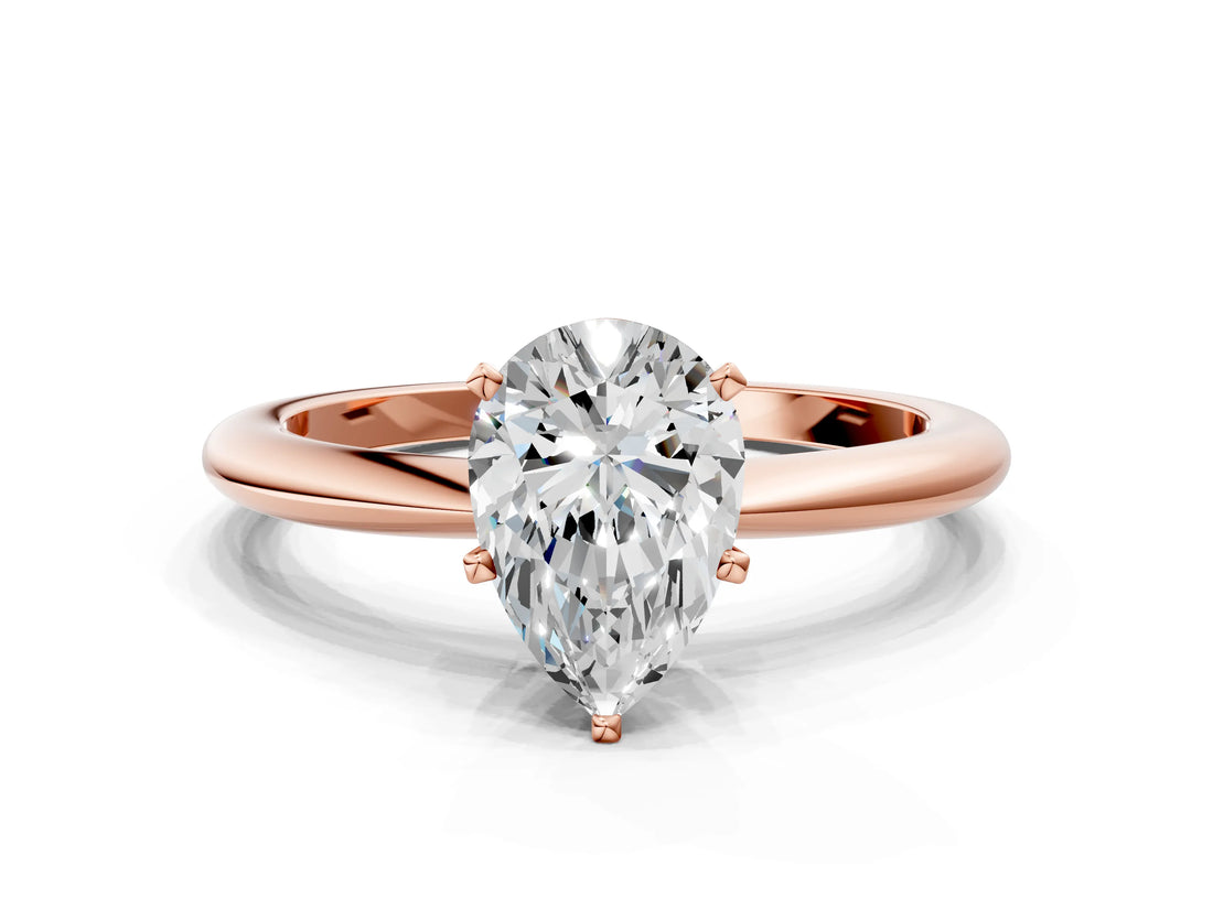 Rose gold Pear Solitaire Diamond Ring with Six-Prong Setting on a Classic Band