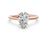 Rose gold Pear Solitaire Diamond Ring with a Classic Band and Four-Prong Setting