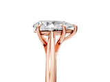 Rose gold Pear Solitaire Engagement Ring with Four-Prong Setting and Classic Band