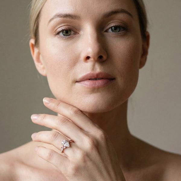 Rose gold Pear Solitaire Leaf-Inspired Diamond Ring with Pavé Band and Four-Prong Setting