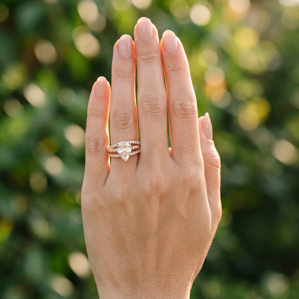 Rose gold Pear Solitaire Twist Band with Pavé Setting and Four-Prong Setting