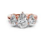 Rose gold Pear Three-Stone Diamond Ring with Prong Setting on a Classic Band_15